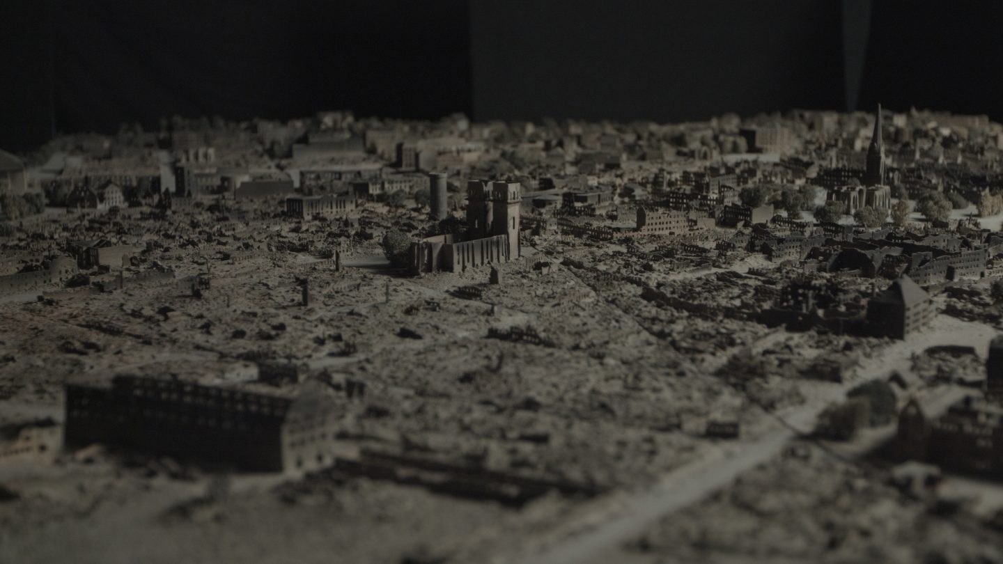 A darkened view of a town all in tan.